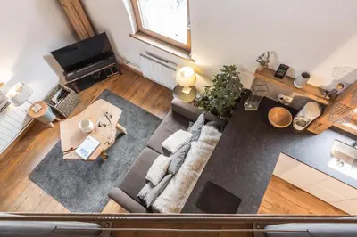 an overhead view of a living room with a couch and a table at Apartment Vila 2 - Charming 2 Bedroom Haven in Chamonix in Chamonix-Mont-Blanc