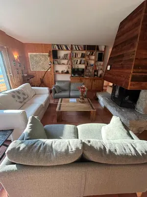 a living room with a couch and a fireplace at Carpe Diem in Sixt
