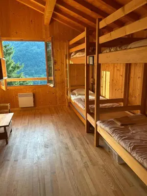 a room with two bunk beds and a window at Carpe Diem in Sixt