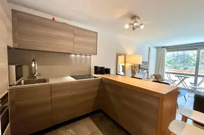 a kitchen with a sink and a counter top at Parenthèse Rochebrune in Megève