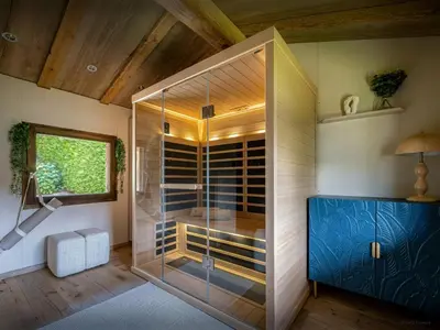 a walk in shower with a glass door at Chalet Snow Love - OVO Network in Megève