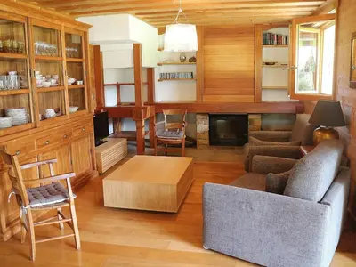 a living room with a couch and a fireplace at Chalet spacieux à Samoëns, proche village, jusqu'à 11 personnes, WiFi, parking - FR-1-815-3 in Samoëns