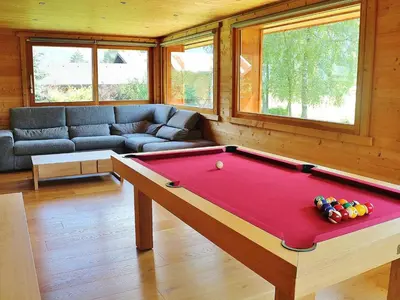 a living room with a pool table in it at Chalet spacieux à Samoëns, proche village, jusqu'à 11 personnes, WiFi, parking - FR-1-815-3 in Samoëns