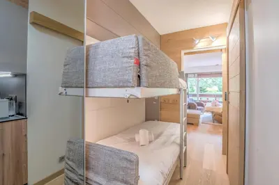 a bedroom with a bunk bed in a room at Studio Capucines - Welkeys in Megève