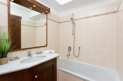 a bathroom with a sink and a shower at Pothecary apartment -Chamonix All Year in Chamonix-Mont-Blanc