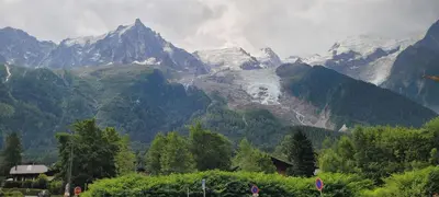 a view of a mountain range with trees and mountains at Grand studio près Lac Gaillands in Chamonix-Mont-Blanc