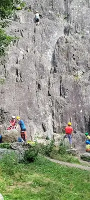 a group of people climbing a rock wall at Grand studio près Lac Gaillands in Chamonix-Mont-Blanc