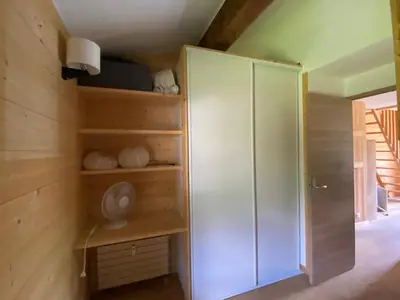 a room with a large white cabinet in a room at Appartement exceptionnel au Lavancher à chamonix in Chamonix-Mont-Blanc