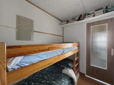 a bunk bed in a small room with a window at BB222 - Appartement 6 pers pied de pistes in Les Carroz d'Araches