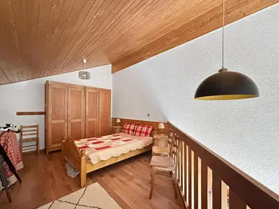 a bedroom with a bed and a wooden ceiling at BB222 - Appartement 6 pers pied de pistes in Les Carroz d'Araches