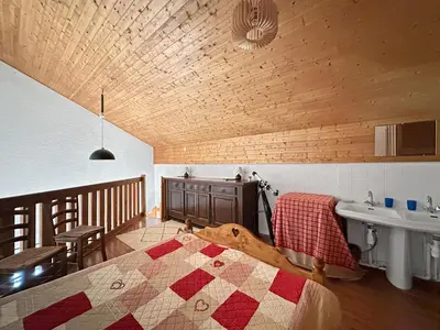 a bedroom with a bed and a sink in a room at BB222 - Appartement 6 pers pied de pistes in Les Carroz d'Araches