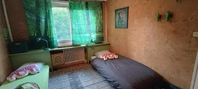 a bedroom with a bed in a room with a window at Maison idéalement située toutes mobilités in Saint-Gervais-les-Bains