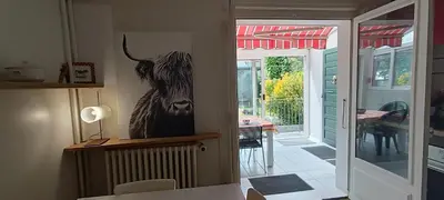 a picture of a bull on the wall in a kitchen at Maison idéalement située toutes mobilités in Saint-Gervais-les-Bains