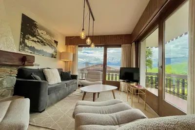 a room with a window with a view of mountains at Balcon des cimes - 80 m in Combloux