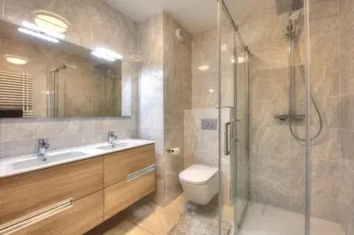 a bathroom with a shower and a toilet and a sink at Open the door and Hike, Ski or Bike 3 Br Apartment Saint Gervais in Saint-Gervais-les-Bains