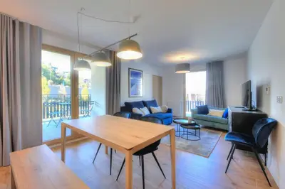 a living room with a dining table and a living room at Open the door and Hike, Ski or Bike 3 Br Apartment Saint Gervais in Saint-Gervais-les-Bains