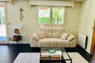 a living room with a couch and a table at Spacious chalet in Chamonix with Mont Blanc view in Chamonix-Mont-Blanc