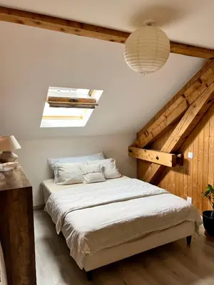 a bedroom with a bed and a skylight at Duplex MontBlanc - Suite, Centre & Parking by AlpenlySallanches in Sallanches