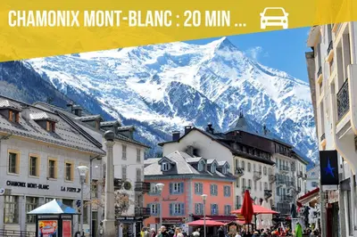 a view of a snow covered mountain in a city at Duplex MontBlanc - Suite, Centre & Parking by AlpenlySallanches in Sallanches