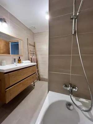 a bathroom with a shower and a tub and a sink at Duplex MontBlanc - Suite, Centre & Parking by AlpenlySallanches in Sallanches