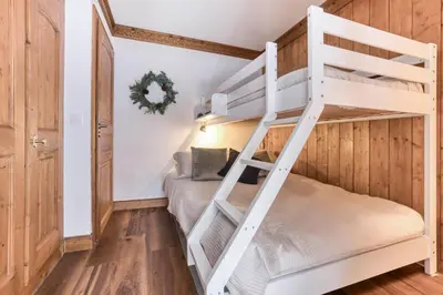 a bunk bedded room with a bunk bed in a house at T3 Argentière in Chamonix-Mont-Blanc