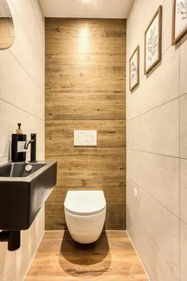 a bathroom with a toilet and a sink at T3 Argentière in Chamonix-Mont-Blanc