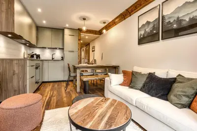 a living room with a couch and a table at T3 Argentière in Chamonix-Mont-Blanc
