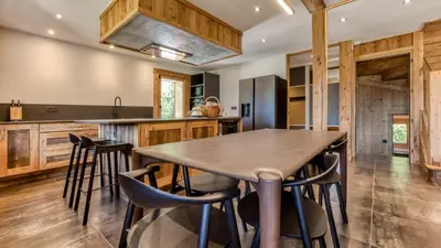 a living room with a couch and a table at Chalet Follette in Chamonix-Mont-Blanc