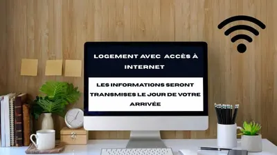 a computer monitor sitting on top of a desk at Le bel alp- Coeur de montagne en centre ville in Saint-Gervais-les-Bains