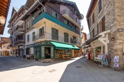 a street in a city with a building at Résidence Le Panorama - Megève in Megève