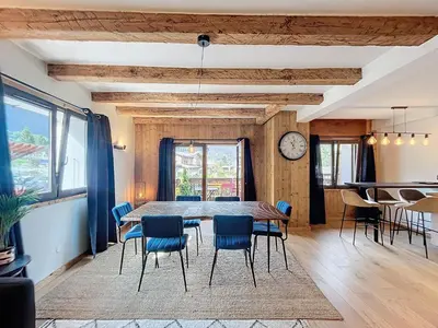 a dining room with a table and chairs at Appartement Alpage in Les Houches