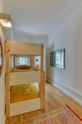 a bedroom with two bunk beds in a room at Majestic Chamonix in Chamonix-Mont-Blanc