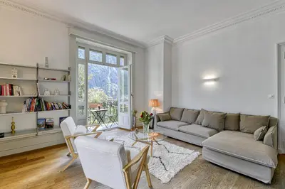 a living room with a couch and a table at Majestic Chamonix in Chamonix-Mont-Blanc