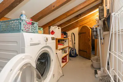a washer and dryer in a laundry room at Nid douillet rénové sur les pistes ski in out in Megève