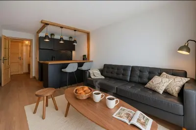 a kitchen with a counter with some food on it at Cosy nest with balcony in the middle of Argentière in Chamonix-Mont-Blanc