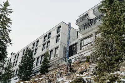 a bedroom with a large bed and a window at Totem, Friendly Hotel & Spa in Flaine