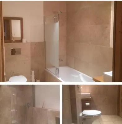 a bathroom with a toilet and a tub and a sink at Beautiful 2BR in Chamonix Centre in Chamonix-Mont-Blanc