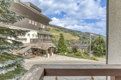 a view of a building with a mountain in the background at Glacier in Megève