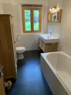 a bathroom with a tub and a sink and a toilet at Amazing Mt Blanc View 2 Bed, Parking, 10mins walk in Chamonix-Mont-Blanc