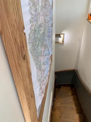a door with a map on the side of a hallway at Amazing Mt Blanc View 2 Bed, Parking, 10mins walk in Chamonix-Mont-Blanc