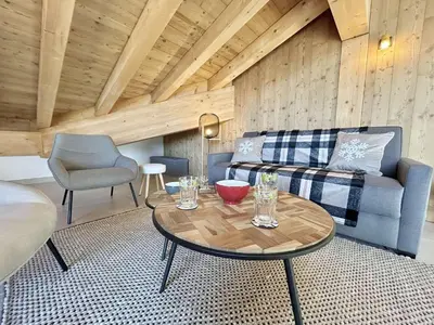 a living room with a couch and a table at Appartement 3 Pièces, 4-6 couchages, COMBLOUX COM100-A402 in Combloux