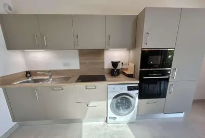 a kitchen with a sink and a washing machine at Appartement 3 Pièces, 4-6 couchages, COMBLOUX COM100-A402 in Combloux