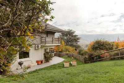 a house with a garden in the yard at Le Montagny Sejour Cosy au Coeur des Alpes in Sallanches