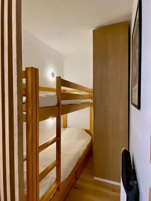 a couple of bunk beds in a room at Le Sapin A5 in Megève