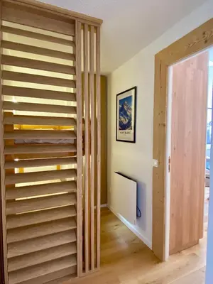 a room with a closet with wooden shelves at Le Sapin A5 in Megève