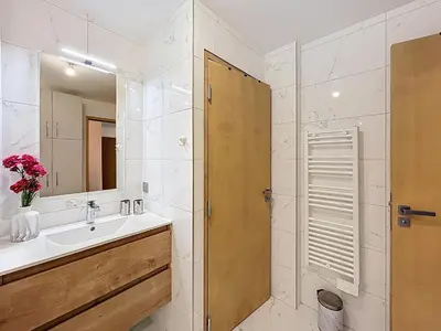a bathroom with a sink and a mirror at Charmant appartement à Combloux près des pistes avec parking - FR-1-560-166 in Combloux