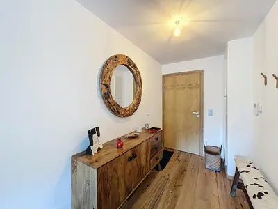 a room with a wooden dresser and a mirror on the wall at Charmant appartement à Combloux près des pistes avec parking - FR-1-560-166 in Combloux