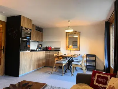 a kitchen and dining room with a table and chairs at Résidence Les Crocus - Crocus 3 MAE-5013 in Mémontel
