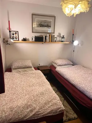 two beds in a room with red candles on the wall at Résidence Les Crocus - Crocus 3 MAE-5013 in Mémontel
