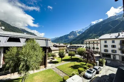 a view of a city with mountains in the background at Stay in the heart of Chamonix close to the slopes in Chamonix-Mont-Blanc